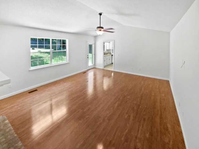 7110 Ridgestone Dr, Ooltewah, TN 37363 - unfurnished living room with a ceiling fan, wood finished floors, and lofted ceiling