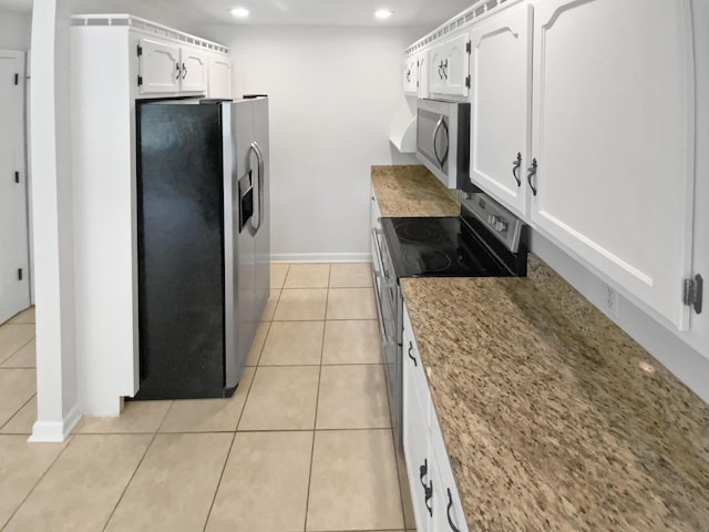 7110 Ridgestone Dr, Ooltewah, TN 37363 - kitchen with appliances with stainless steel finishes, recessed lighting, white cabinetry, light tile patterned flooring, and light stone counters