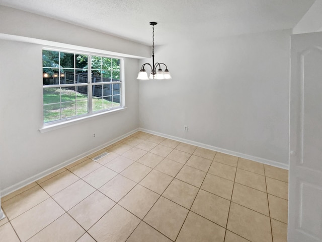 7110 Ridgestone Dr, Ooltewah, TN 37363 - empty room featuring a chandelier and light tile patterned flooring