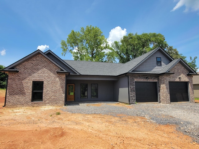 202 Cheshire Crossing Dr, Rock Spring, GA 30739 - view of front facade featuring a garage, driveway, brick siding, and a shingled roof