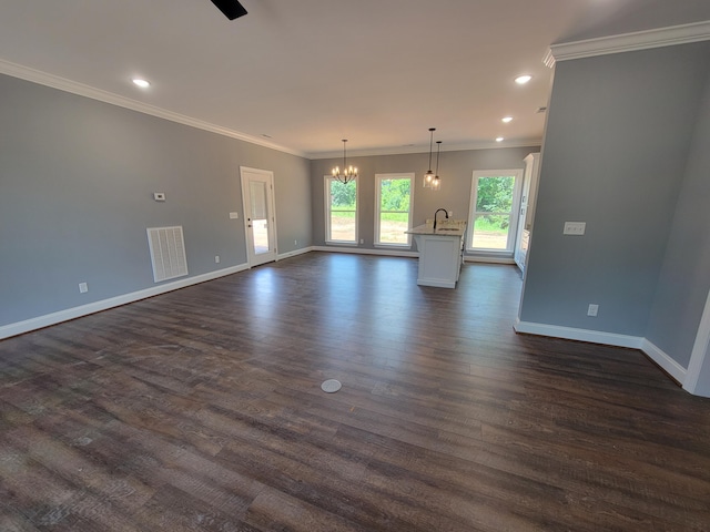 202 Cheshire Crossing Dr, Rock Spring, GA 30739 - unfurnished living room featuring a chandelier, dark wood finished floors, ornamental molding, and recessed lighting