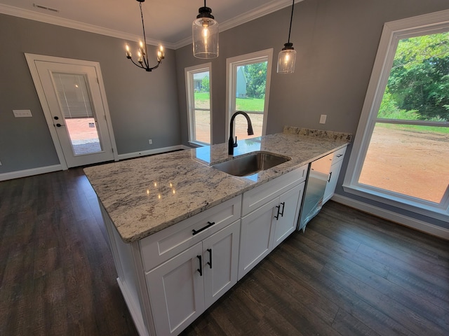 202 Cheshire Crossing Dr, Rock Spring, GA 30739 - kitchen featuring a peninsula, white cabinets, dark wood-type flooring, light stone counters, and hanging light fixtures