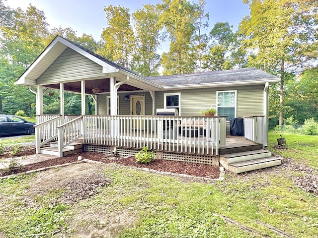 100 Anderson Ridge Rd, Jasper, TN 37347 - back of house featuring a lawn, covered porch, and a shingled roof