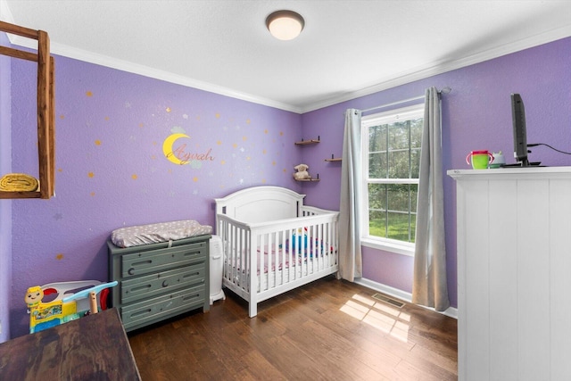 100 Anderson Ridge Rd, Jasper, TN 37347 - bedroom with wood finished floors, ornamental molding, and a crib