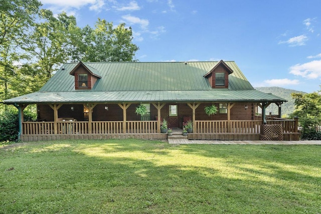 2875 Stagecoach Rd, Sewanee, TN 37375 - view of front of home with covered porch, a front yard, and a metal roof