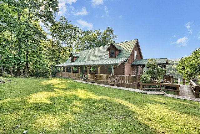 2875 Stagecoach Rd, Sewanee, TN 37375 - log-style house with a front yard, a metal roof, and covered porch
