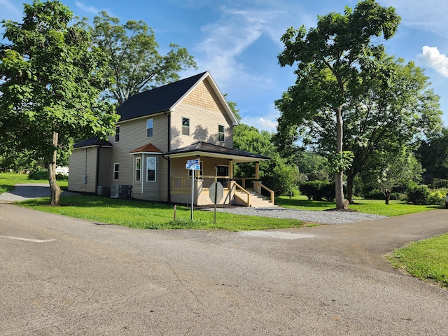 1 Magnolia St, Niota, TN 37826 - view of front of property with a porch and a front lawn