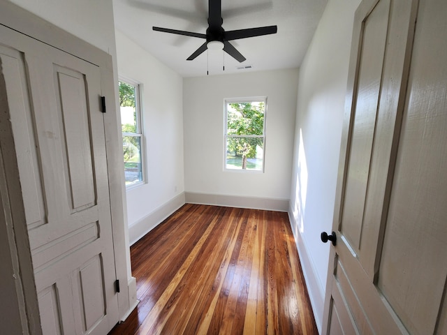 1 Magnolia St, Niota, TN 37826 - empty room with hardwood / wood-style flooring and a ceiling fan