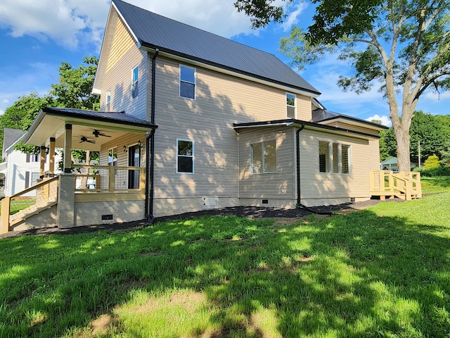 1 Magnolia St, Niota, TN 37826 - back of property featuring a ceiling fan, crawl space, a lawn, and a metal roof