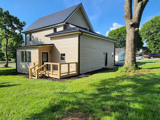 1 Magnolia St, Niota, TN 37826 - back of property featuring a deck and a lawn