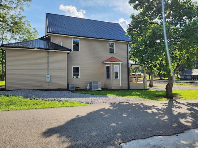 1 Magnolia St, Niota, TN 37826 - view of property exterior featuring a metal roof and a central air condition unit