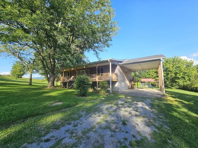 770 Jack Smith Rd Unit 15, Dunlap, TN 37327 - back of house with a lawn, driveway, and a carport
