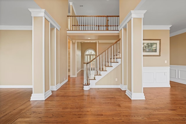 6401 Beacon Pointe Cir, Hixson, TN 37343 - stairs featuring wood finished floors, ornamental molding, wainscoting, and ornate columns