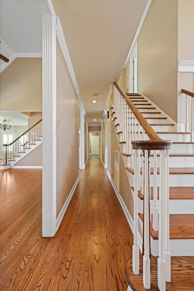 6401 Beacon Pointe Cir, Hixson, TN 37343 - corridor with stairway, wood finished floors, and crown molding