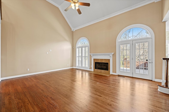 6401 Beacon Pointe Cir, Hixson, TN 37343 - unfurnished living room featuring ornamental molding, plenty of natural light, high vaulted ceiling, a tile fireplace, and ceiling fan