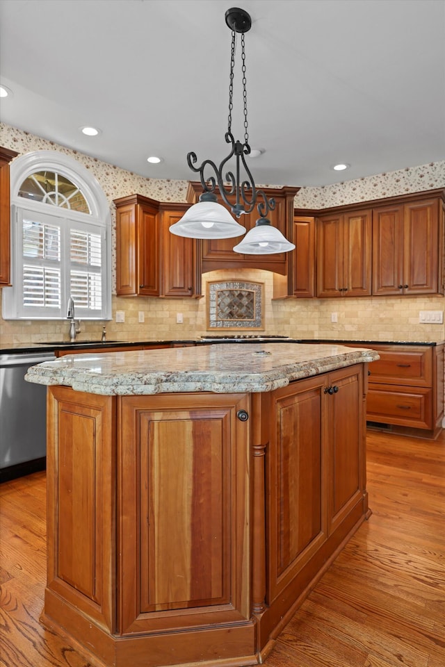 6401 Beacon Pointe Cir, Hixson, TN 37343 - kitchen featuring dishwasher, a kitchen island, light wood-type flooring, light stone counters, and recessed lighting