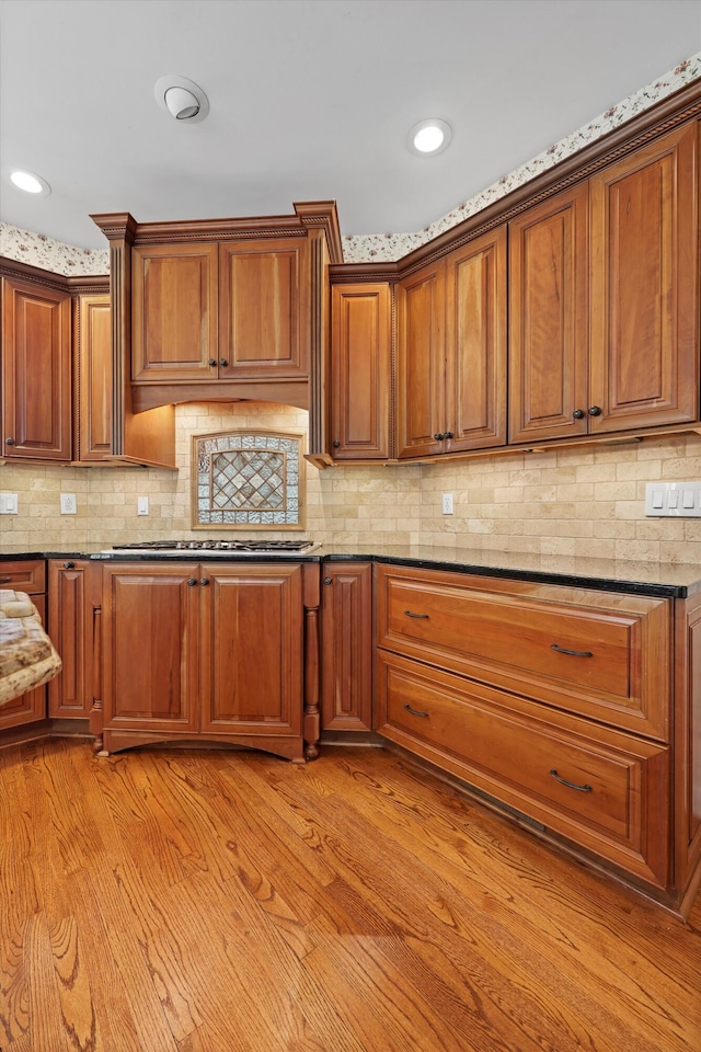 6401 Beacon Pointe Cir, Hixson, TN 37343 - kitchen with stainless steel gas cooktop, brown cabinets, light wood finished floors, and recessed lighting