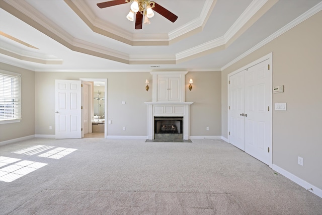 6401 Beacon Pointe Cir, Hixson, TN 37343 - unfurnished living room featuring a tray ceiling, light colored carpet, a ceiling fan, ornamental molding, and a fireplace