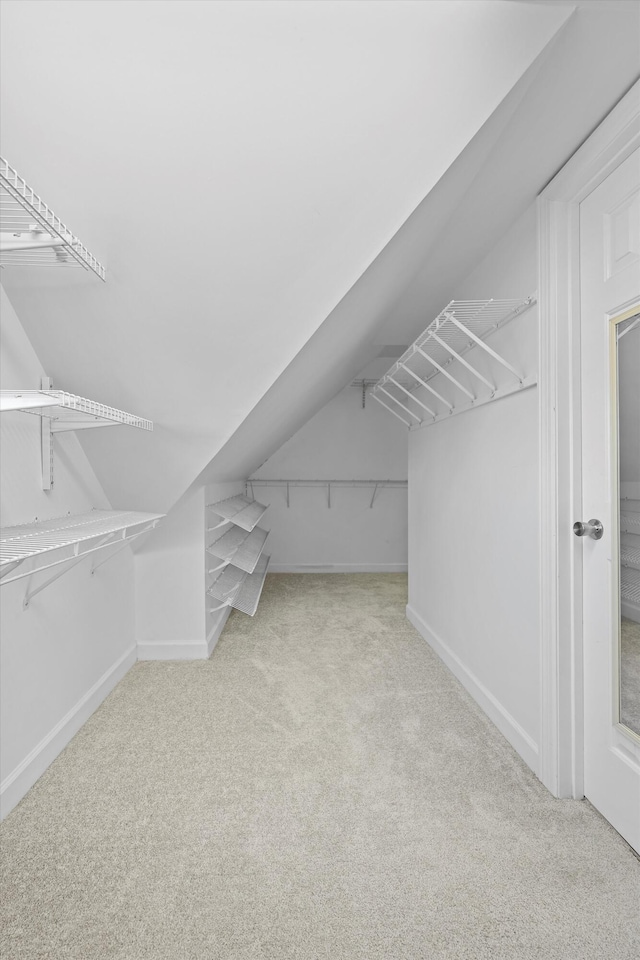 6401 Beacon Pointe Cir, Hixson, TN 37343 - spacious closet featuring carpet flooring and vaulted ceiling