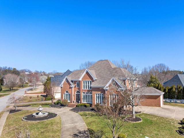 6401 Beacon Pointe Cir, Hixson, TN 37343 - view of front of home with driveway, brick siding, and a front yard