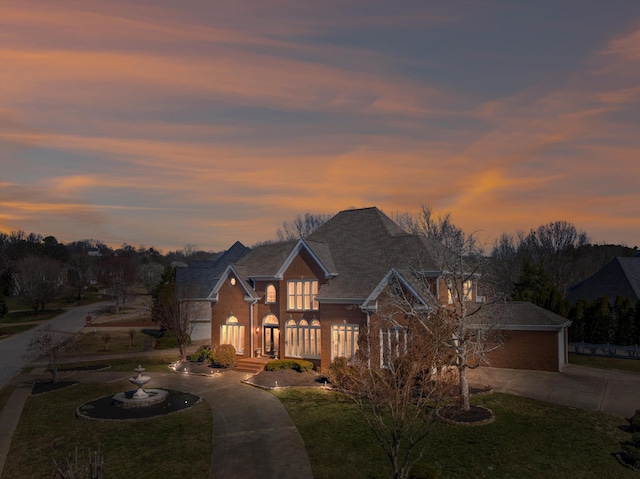 6401 Beacon Pointe Cir, Hixson, TN 37343 - traditional home featuring curved driveway, a front lawn, and brick siding