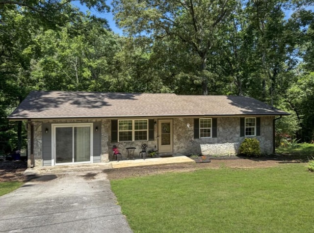 300 Marion Dr, Ringgold, GA 30736 - single story home with stone siding, a front lawn, a porch, and asphalt driveway