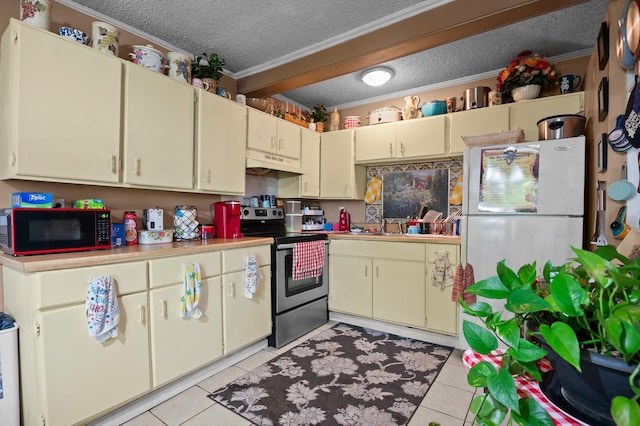 1618 E State Line Rd, Rossville, GA 30741 - kitchen featuring electric stove, under cabinet range hood, cream cabinets, a textured ceiling, and ornamental molding