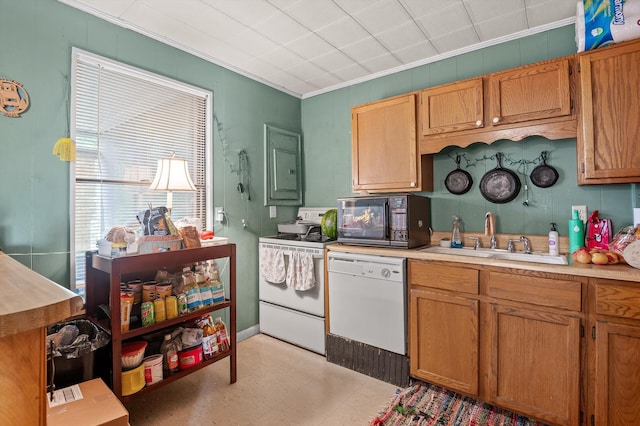 1618 E State Line Rd, Rossville, GA 30741 - kitchen featuring white appliances, crown molding, light flooring, light countertops, and brown cabinets