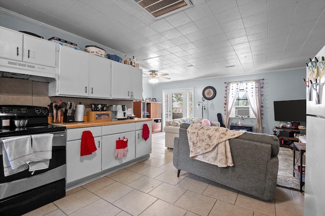 1618 E State Line Rd, Rossville, GA 30741 - kitchen with range with electric stovetop, under cabinet range hood, open floor plan, ornamental molding, and white cabinetry