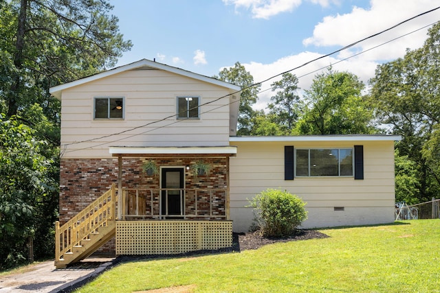 137 N Hidden Valley Rd, Rossville, GA 30741 - back of house featuring crawl space, a lawn, and brick siding