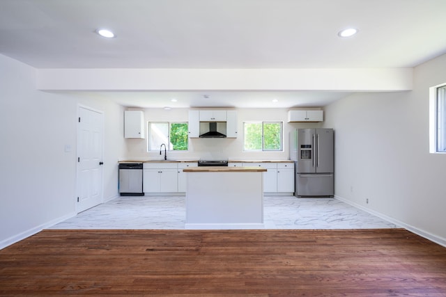 137 N Hidden Valley Rd, Rossville, GA 30741 - kitchen with appliances with stainless steel finishes, wall chimney exhaust hood, a center island, white cabinetry, and recessed lighting