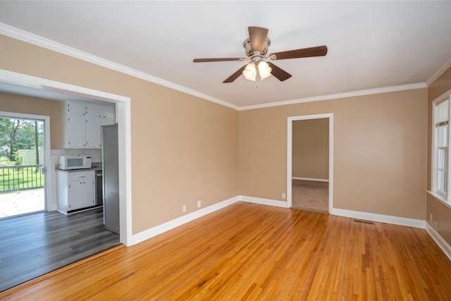 208 Wilder Rd, Chickamauga, GA 30707 - spare room with light wood finished floors, ornamental molding, and ceiling fan