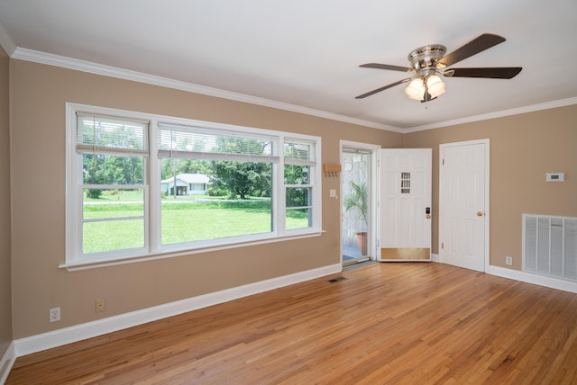 208 Wilder Rd, Chickamauga, GA 30707 - foyer featuring light wood-type flooring, ornamental molding, plenty of natural light, and a ceiling fan