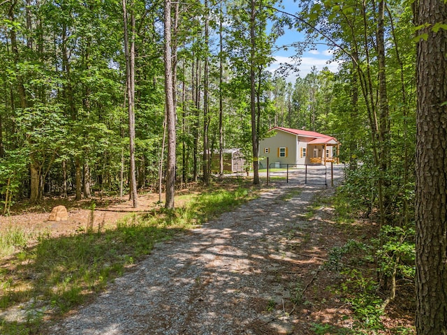 1780 Wolf Haven Rd, Spencer, TN 38585 - view of street with a gate, a gated entry, and a forest view