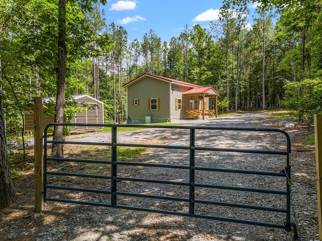 1780 Wolf Haven Rd, Spencer, TN 38585 - view of front of house featuring a gate, a carport, and an outbuilding