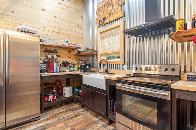 1780 Wolf Haven Rd, Spencer, TN 38585 - kitchen with stainless steel appliances, wall chimney exhaust hood, wood counters, and open shelves