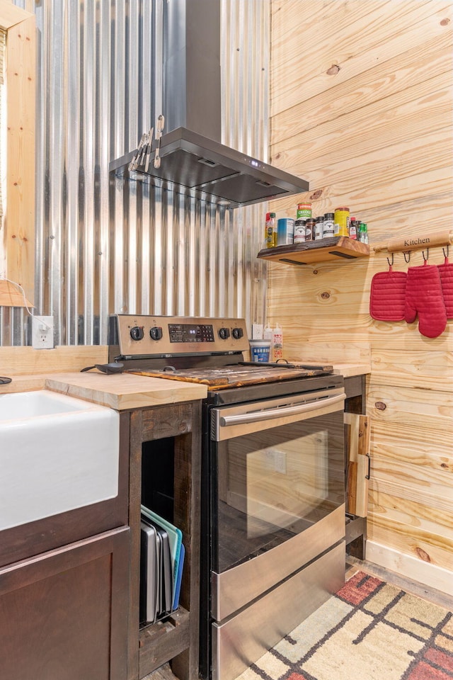 1780 Wolf Haven Rd, Spencer, TN 38585 - kitchen featuring stainless steel electric stove, island exhaust hood, and butcher block counters