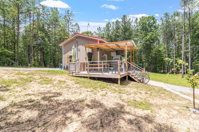 1780 Wolf Haven Rd, Spencer, TN 38585 - view of side of home with a deck and a wooded view