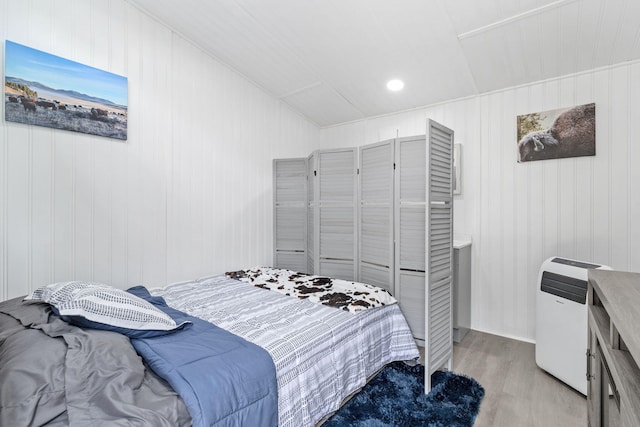 1780 Wolf Haven Rd, Spencer, TN 38585 - bedroom with light wood-style flooring and wood walls