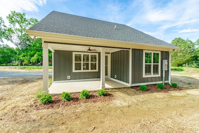 581 W Reed Rd, Lafayette, GA 30728 - rear view of house featuring a shingled roof, board and batten siding, a ceiling fan, and a patio