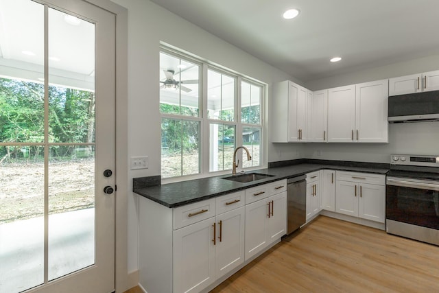 581 W Reed Rd, Lafayette, GA 30728 - kitchen featuring stainless steel appliances, white cabinetry, recessed lighting, light wood-type flooring, and exhaust hood