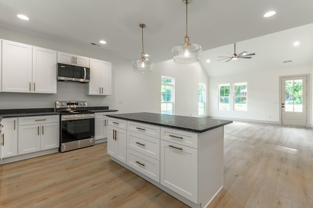 581 W Reed Rd, Lafayette, GA 30728 - kitchen with appliances with stainless steel finishes, recessed lighting, light wood finished floors, white cabinets, and vaulted ceiling