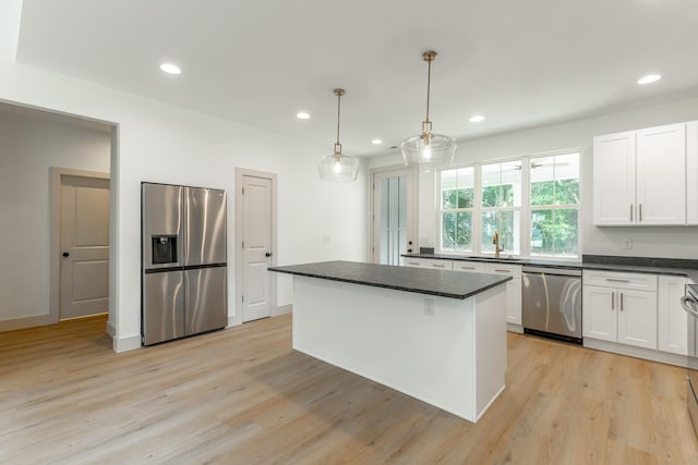 581 W Reed Rd, Lafayette, GA 30728 - kitchen with appliances with stainless steel finishes, dark countertops, light wood-style flooring, and recessed lighting