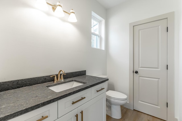 581 W Reed Rd, Lafayette, GA 30728 - half bathroom featuring vanity and wood finished floors