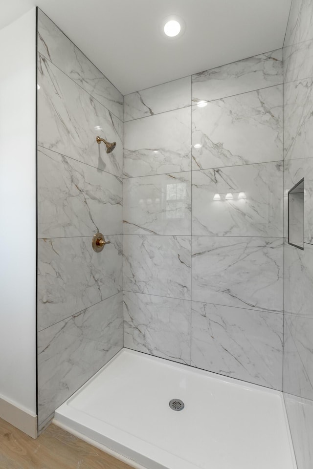 581 W Reed Rd, Lafayette, GA 30728 - full bathroom featuring a tile shower and wood finished floors