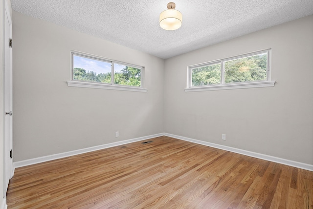 3712 Norma Dr, Chattanooga, TN 37412 - spare room featuring light wood-style floors and a textured ceiling