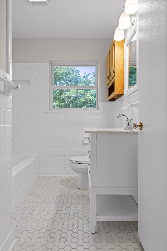 3712 Norma Dr, Chattanooga, TN 37412 - bathroom with vanity, tile walls, and tile patterned flooring