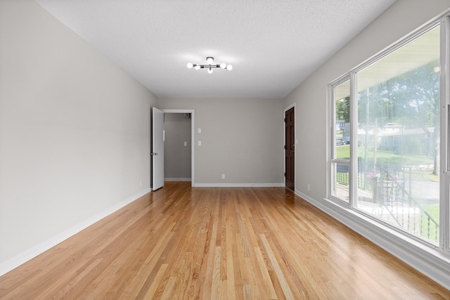 3712 Norma Dr, Chattanooga, TN 37412 - empty room with light wood-type flooring and a textured ceiling