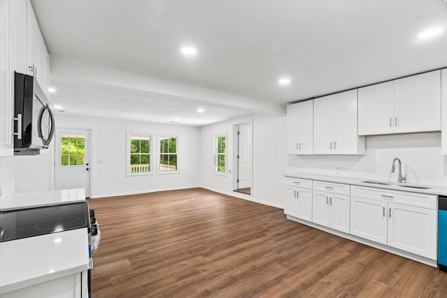 1320 Coker Dr, Dalton, GA 30721 - kitchen featuring light countertops, open floor plan, dark wood-style flooring, white cabinets, and recessed lighting