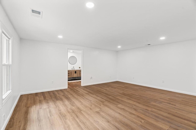 1320 Coker Dr, Dalton, GA 30721 - spare room with wood finished floors and recessed lighting